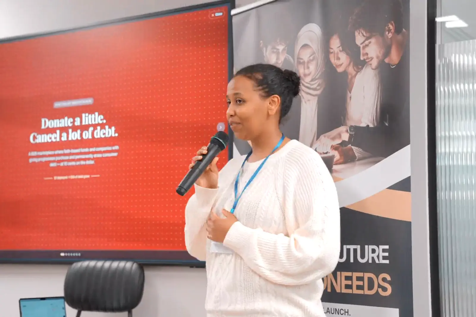A participant presenting a debt relief project at Buildathon London 2026